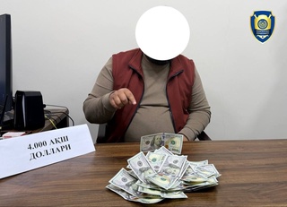 Қарзини қалбаки пулда қайтармоқчи бўлган шахс ушланди