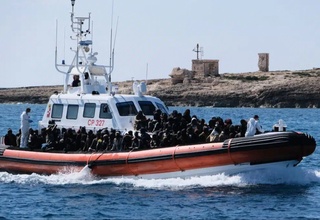 A boat carrying migrants capsized off the coast of the Italian island of Lampedusa, killing 26 people
