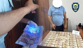 В Асакинском районе задержан инженер, пообещавший за взятку списать долг по электроэнергии